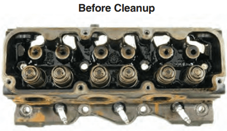 Cylinder head pre-cleanup. Note the sludge deposits on and around the valve springs and push rod openings.
