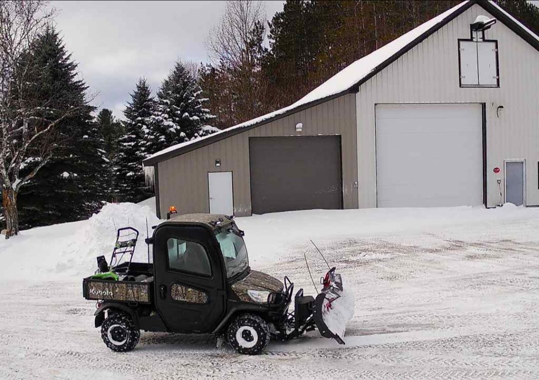 Another of my Kubota RTV's with a snow plow