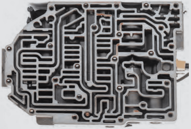 Inside the transmission after the 180,000 severe service mile test in a Las Vegas taxi cab. The transmission’s valve body is clean and virtually sludge-free.